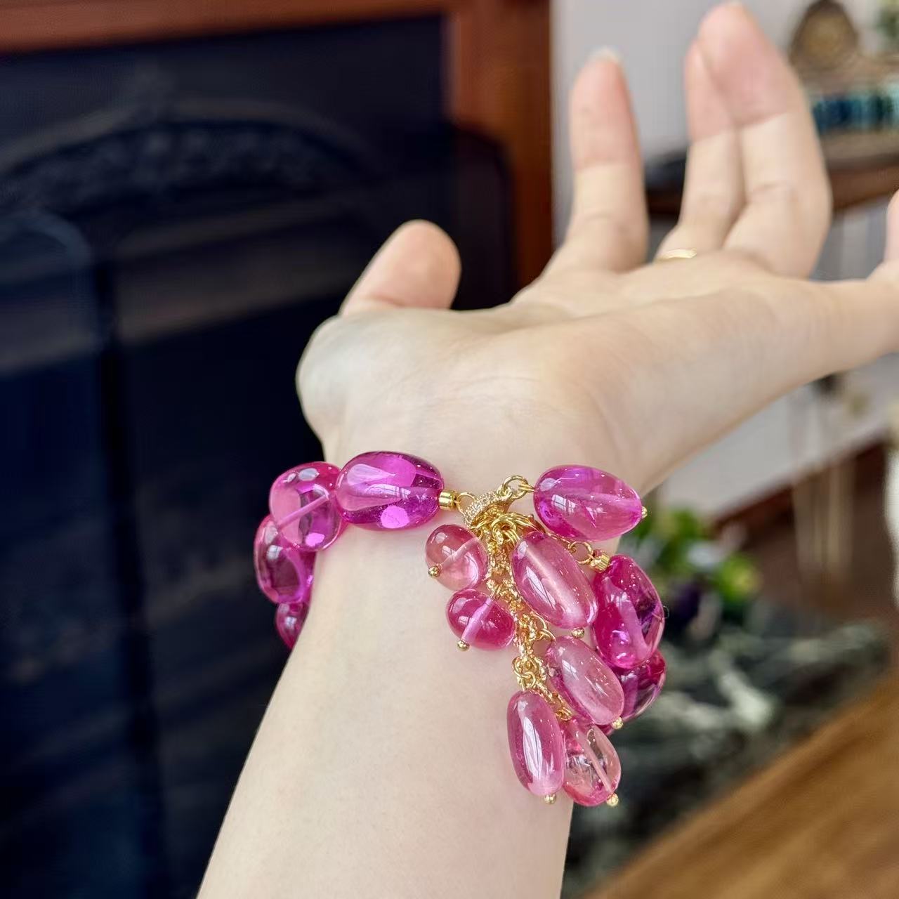 Padparadscha pink bracelet worn on wrist, front view
